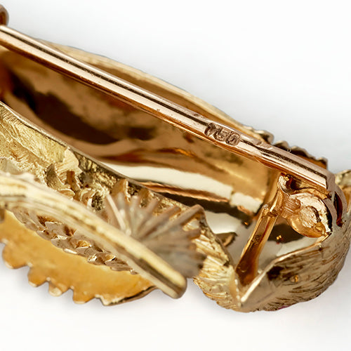 A set of two brooches